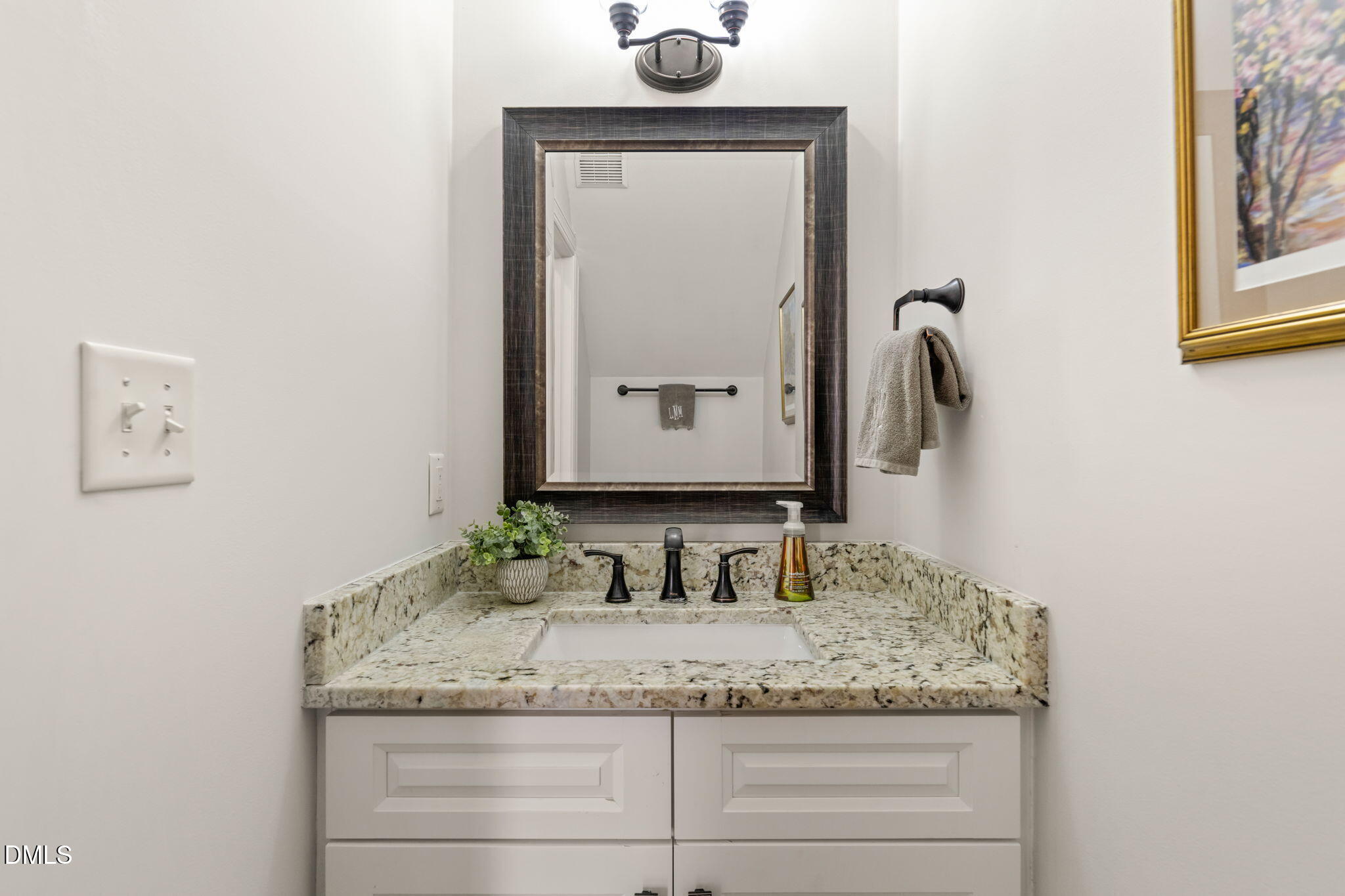 5504 Orchid Hill Drive Raleigh, NC 27613 - Photo 33 of 46 a bathroom with a granite countertop sink and a mirror