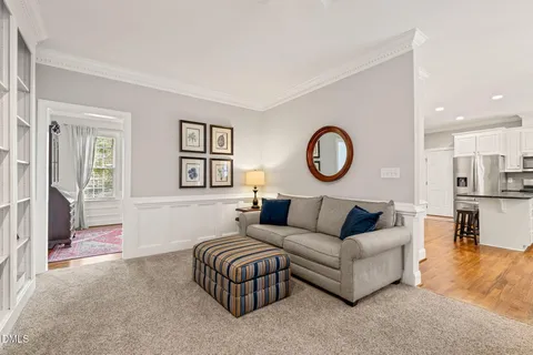 a kitchen with kitchen island a large counter top space and stainless steel appliances