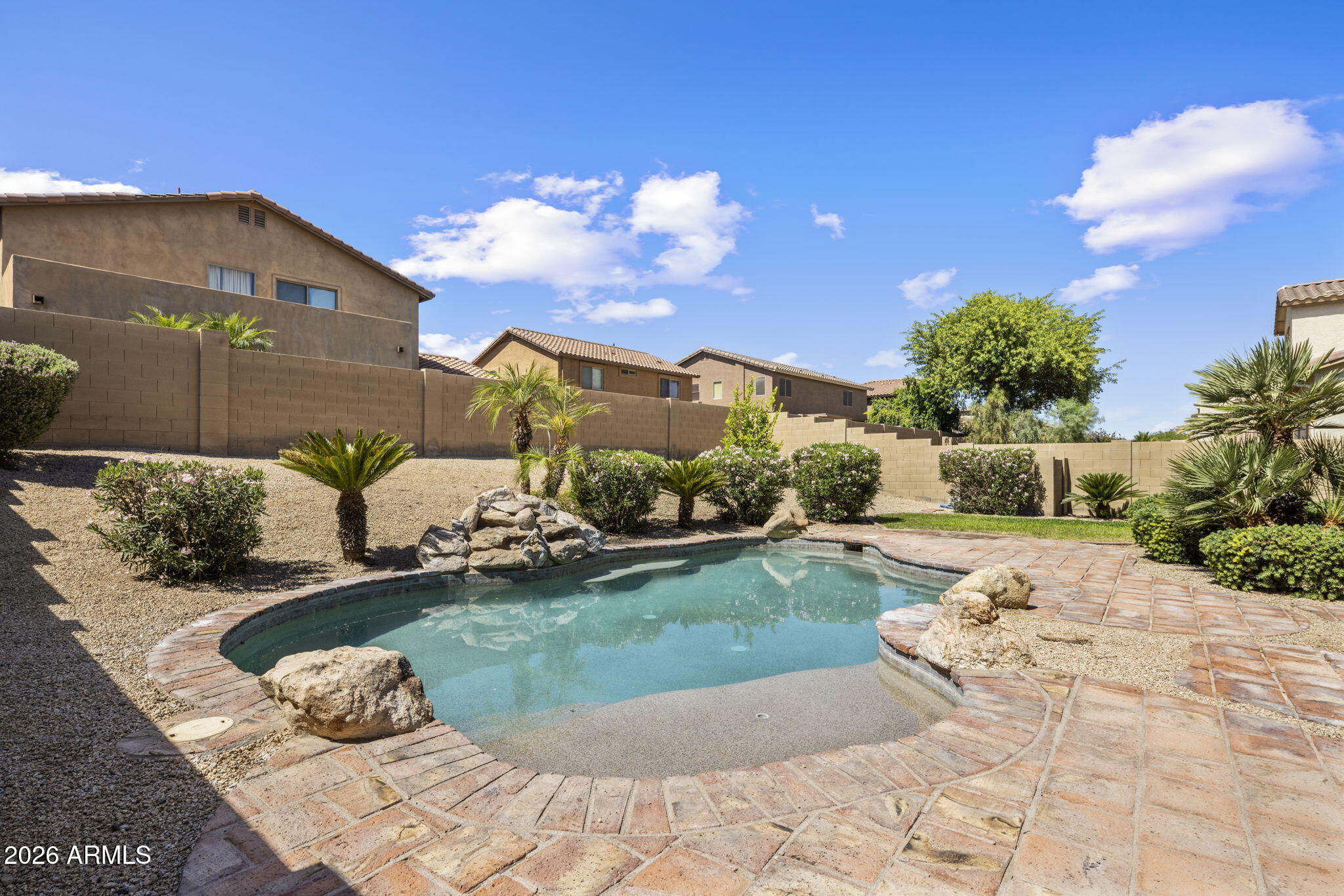 5121 West Beverly Road Laveen, AZ 85339 - Photo 6 of 32 a view of a garden with a building in the background