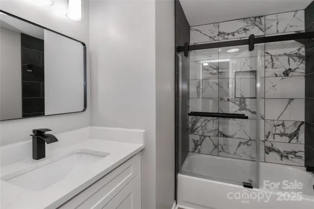 a bathroom with a bathtub and a sink