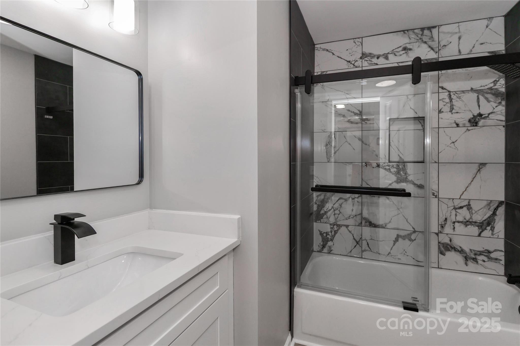 18563 Vineyard Point Lane Cornelius, NC 28031 - Photo 15 of 23 a bathroom with a bathtub and a sink