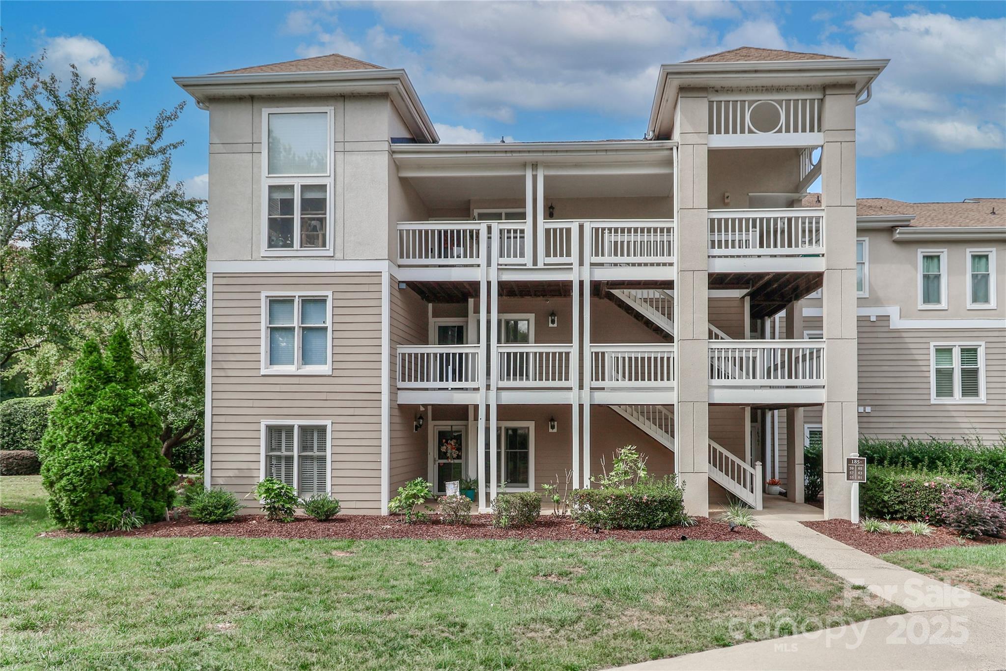 18563 Vineyard Point Lane Cornelius, NC 28031 - Photo 2 of 23 a front view of a house with a yard