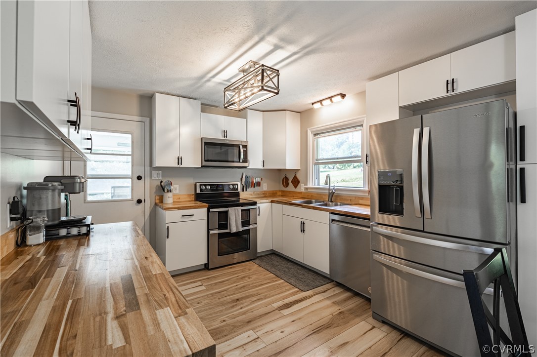 6039 Old Nottoway Road Crewe, VA 23930 - Photo 11 of 46 a kitchen with granite countertop a refrigerator stove and sink