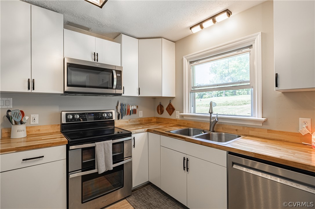 6039 Old Nottoway Road Crewe, VA 23930 - Photo 14 of 46 a kitchen with a sink stove top oven and microwave