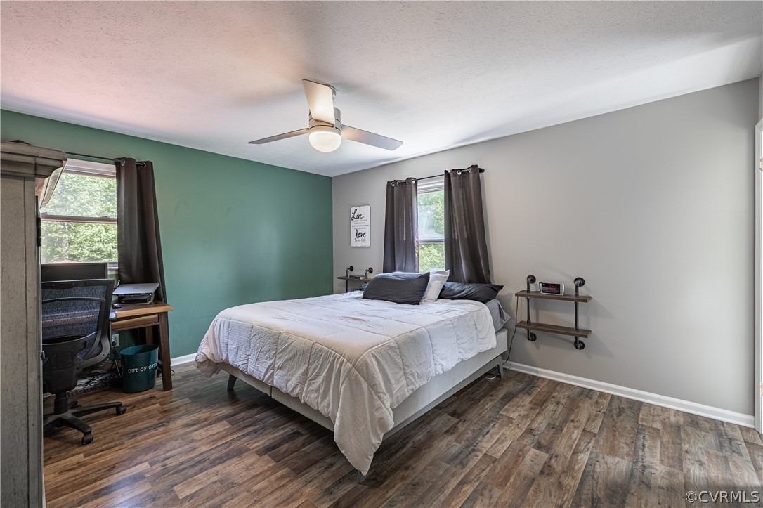 6039 Old Nottoway Road Crewe, VA 23930 - Photo 20 of 46 a bedroom with a bed and a chandelier