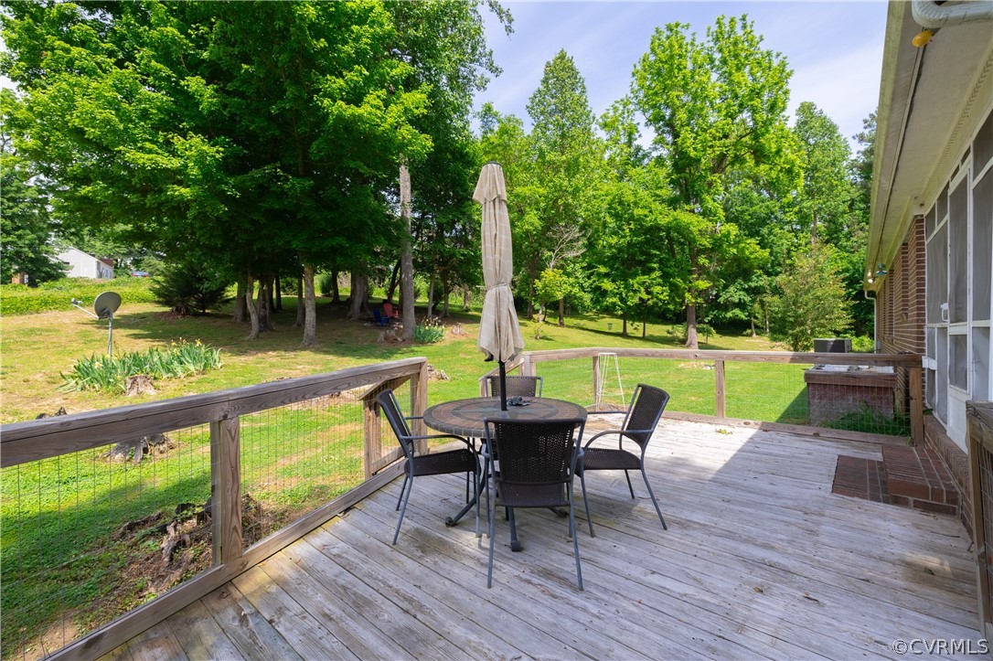 6039 Old Nottoway Road Crewe, VA 23930 - Photo 38 of 46 a view of a chair and table on the wooden deck