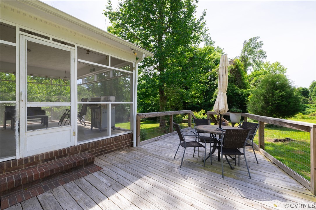 6039 Old Nottoway Road Crewe, VA 23930 - Photo 39 of 46 a view of a chair and table on the wooden deck