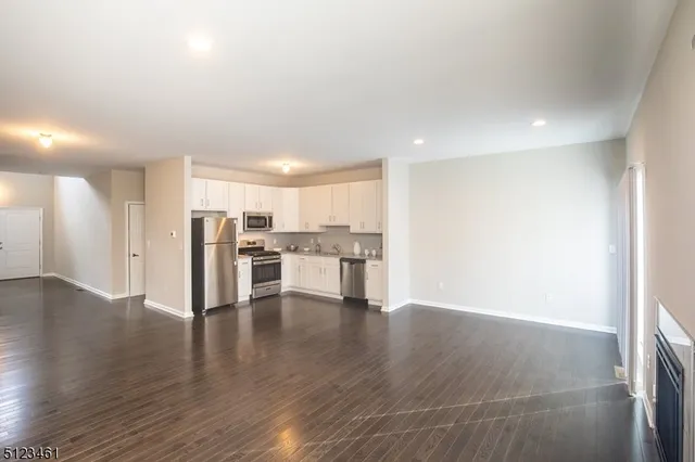 a view of kitchen with wooden floor