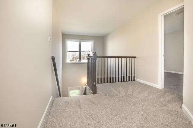 a view of a hallway with a window