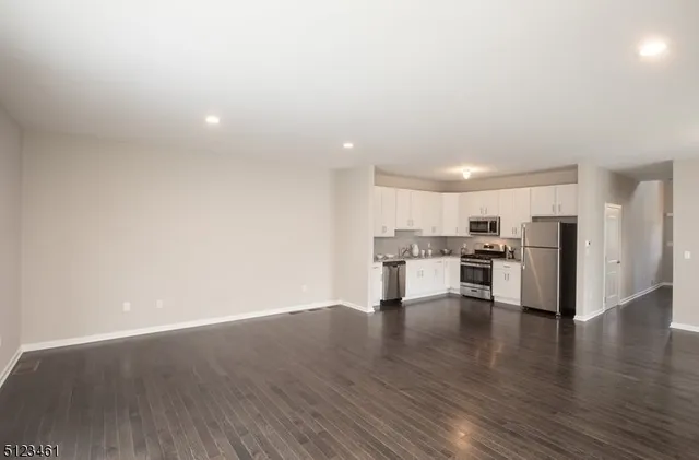 a view of kitchen with wooden floor
