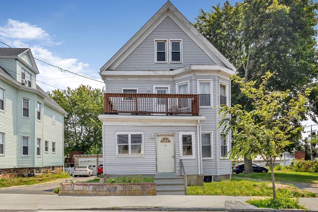 5 Beckford Street, Unit 3 Beverly, MA 01915 - Photo 11 of 15 a front view of a house with a yard