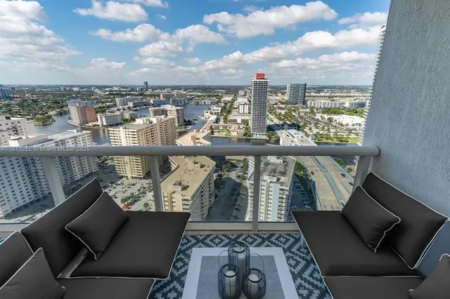 a view of a balcony with an outdoor seating