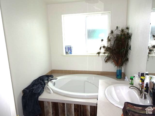 34685 Highway 30 Georgetown, ID 83239 - Photo 11 of 21 Bathroom featuring a bath and a sink