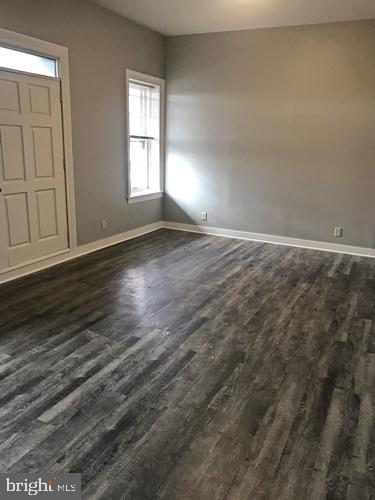 11 North Beaver Street, Unit 304 York, PA 17401 - Photo 3 of 10 an empty room with wooden floor and windows