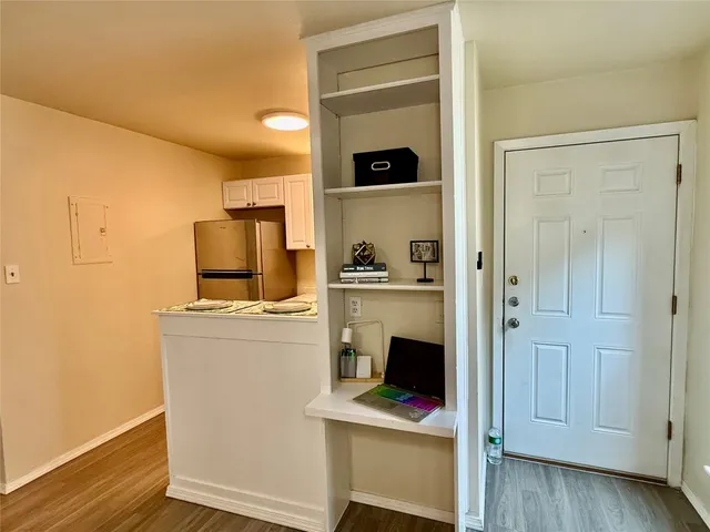 a kitchen with a stove and a refrigerator