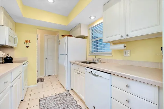 a bathroom with a sink toilet vanity and mirror