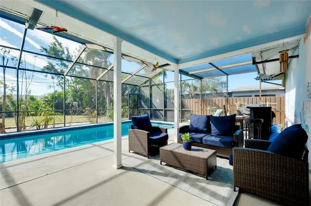 a room with furniture and a potted plant