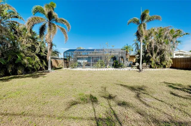 an aerial view of a city with lots of residential buildings and ocean view