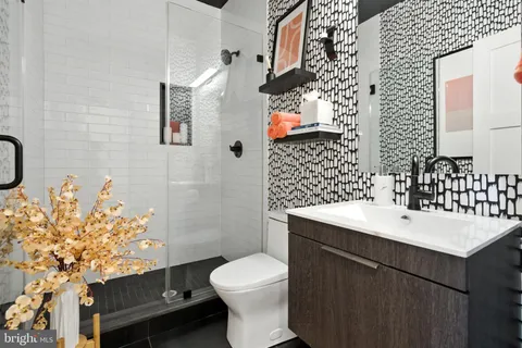 a view of a storage and utility room with washer and dryer