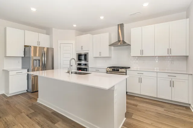 a kitchen with sink and microwave