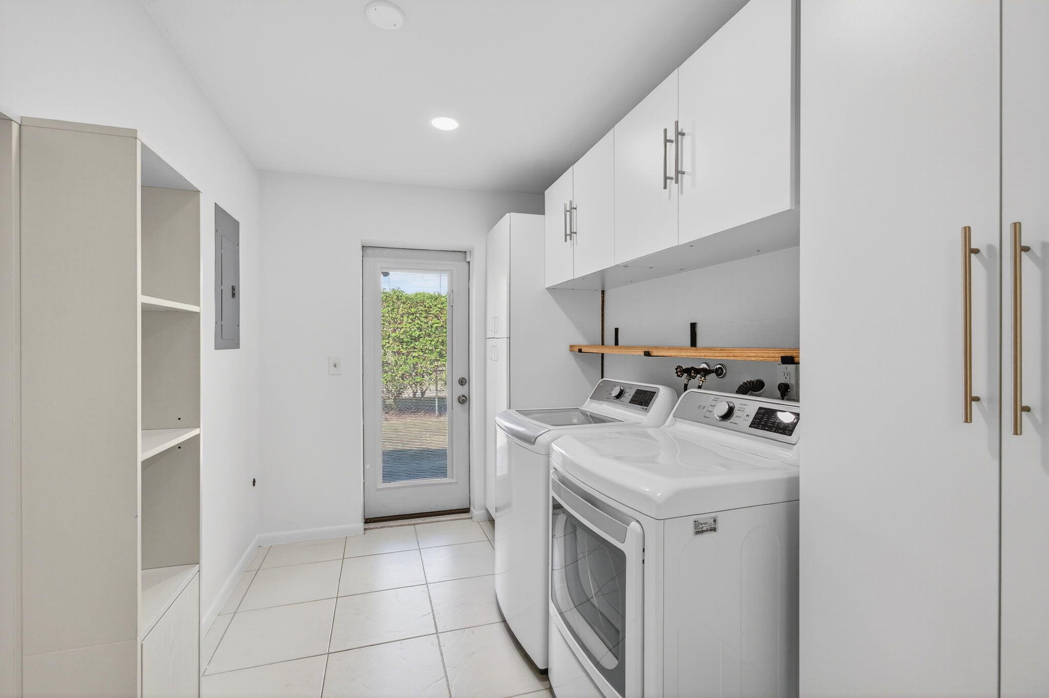 699 Northwest 16th Avenue Boca Raton, FL 33486 - Photo 12 of 39 a kitchen with a sink a stove and cabinets