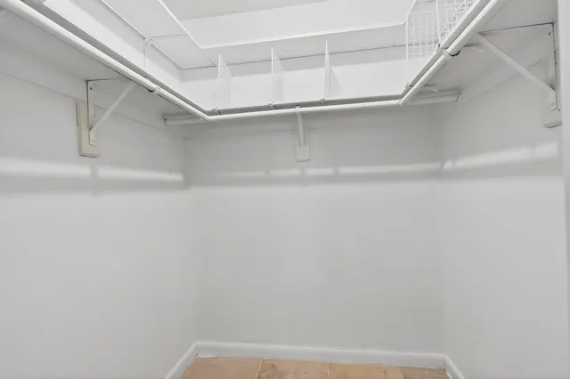 a view of an empty room with a balcony