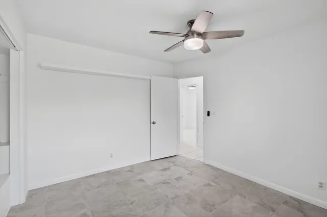 a bathroom with a shower curtain and a toilet