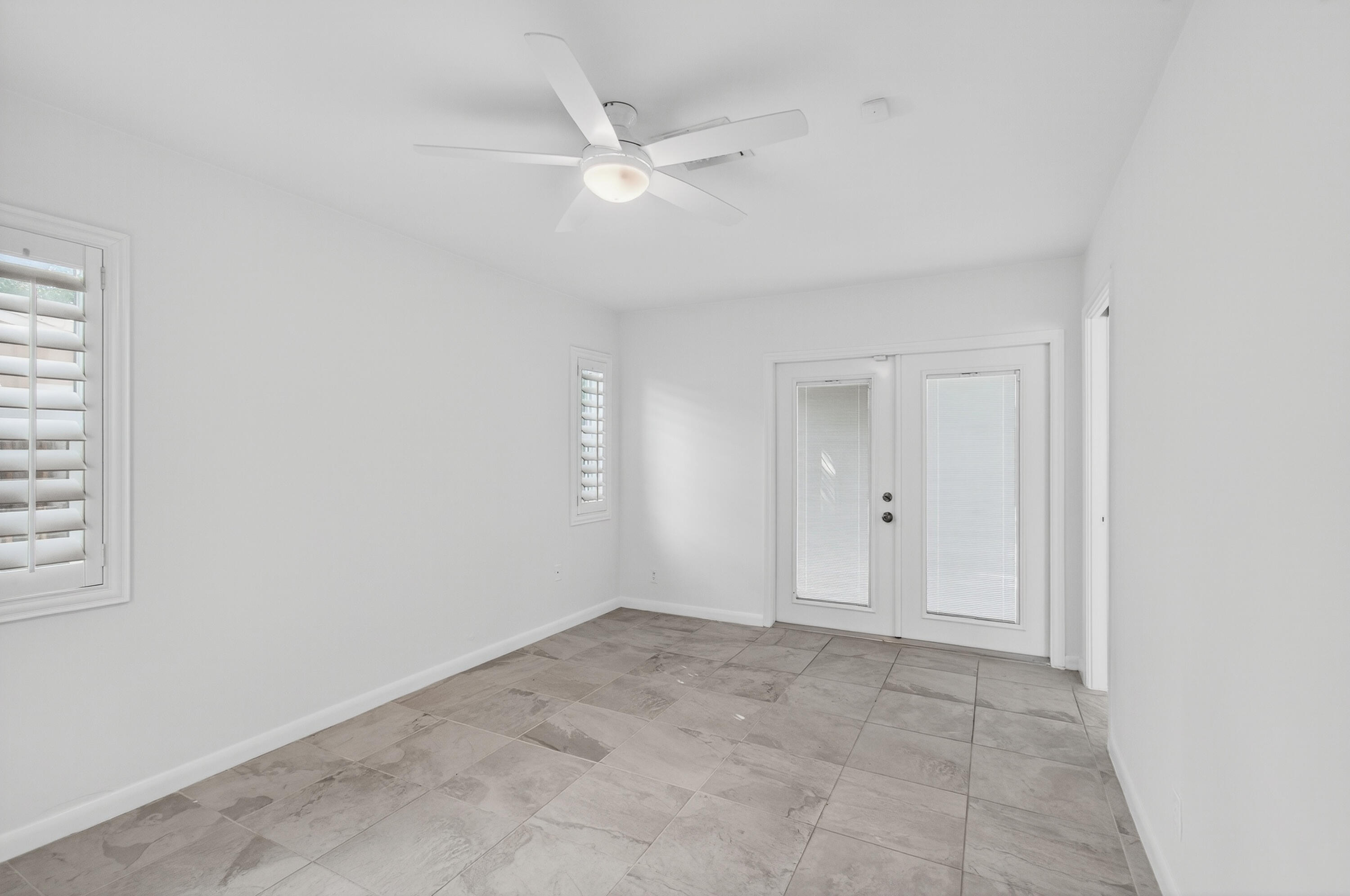 699 Northwest 16th Avenue Boca Raton, FL 33486 - Photo 17 of 46 an empty room with a ceiling fan and window