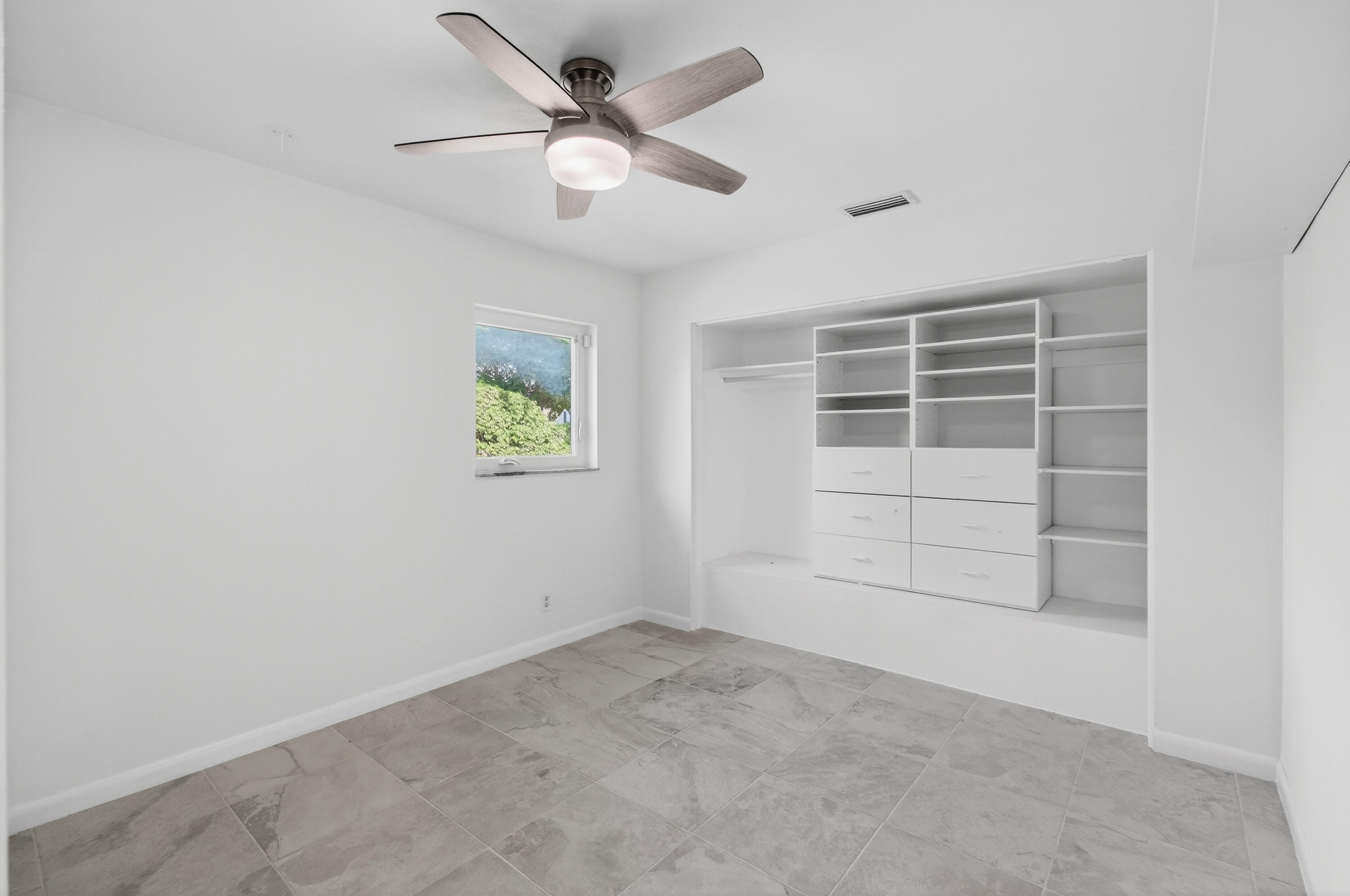 699 Northwest 16th Avenue Boca Raton, FL 33486 - Photo 19 of 39 an empty room with a empty space and windows