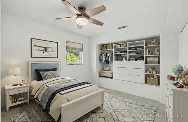 a view of house with backyard and a tree