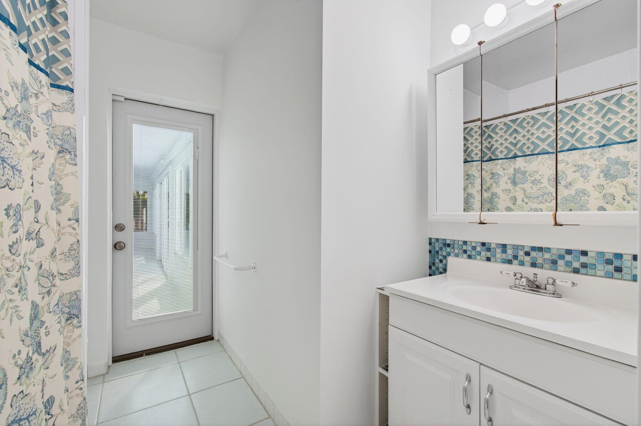 699 Northwest 16th Avenue Boca Raton, FL 33486 - Photo 26 of 39 a bathroom with a sink and a mirror
