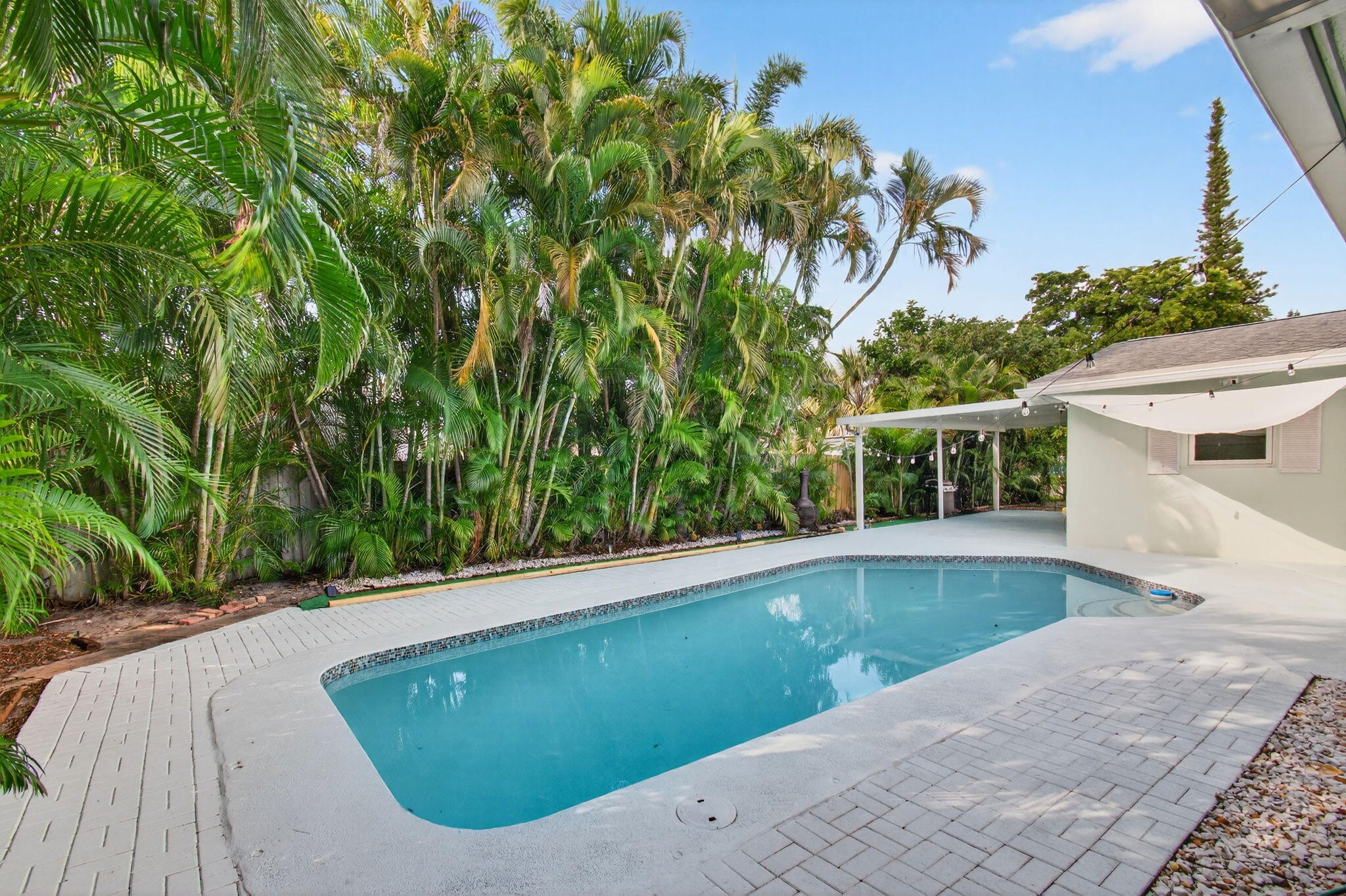 699 Northwest 16th Avenue Boca Raton, FL 33486 - Photo 28 of 32 a view of a swimming pool with a backyard