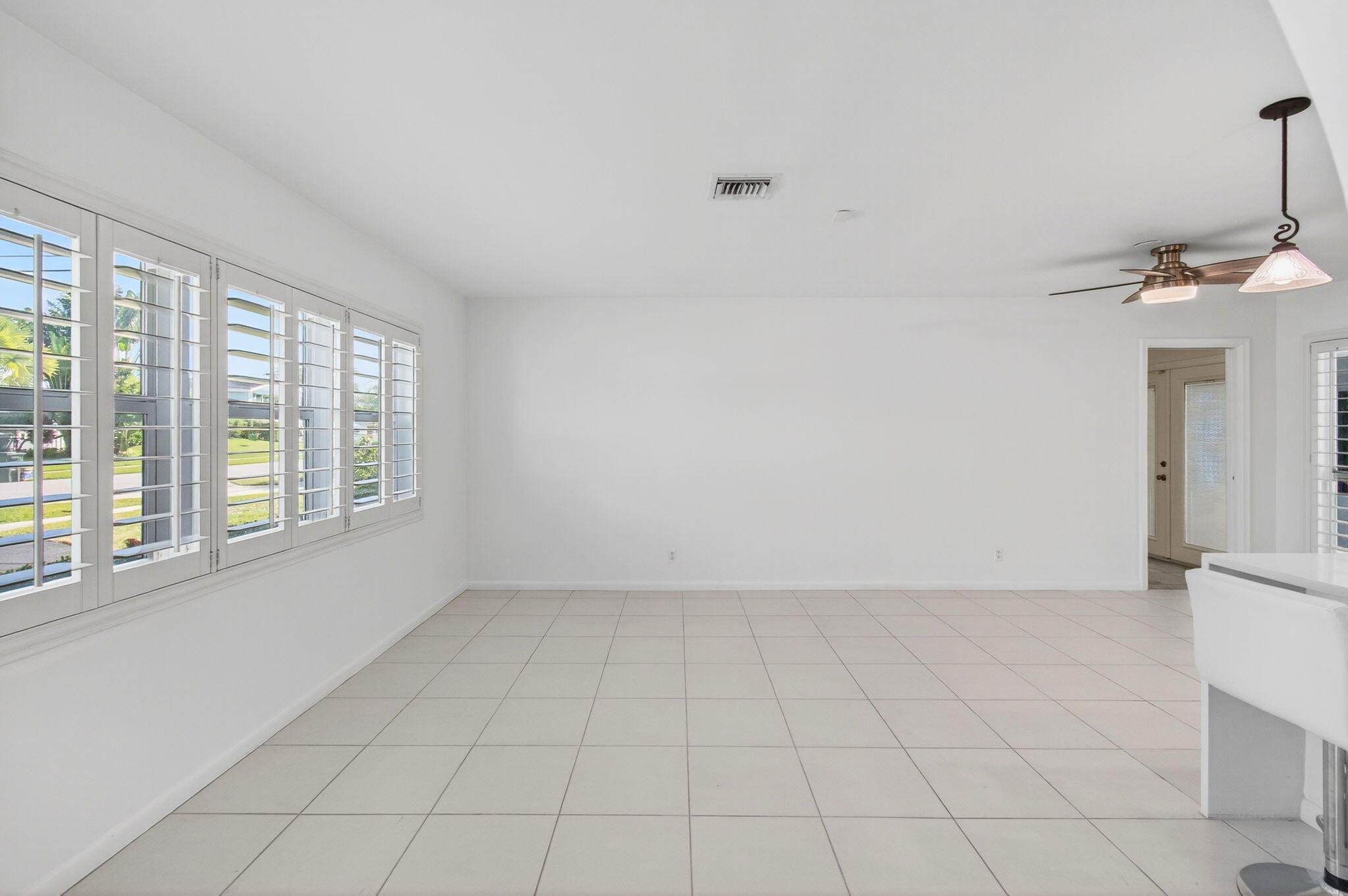 699 Northwest 16th Avenue Boca Raton, FL 33486 - Photo 3 of 32 a view of an empty room with a window