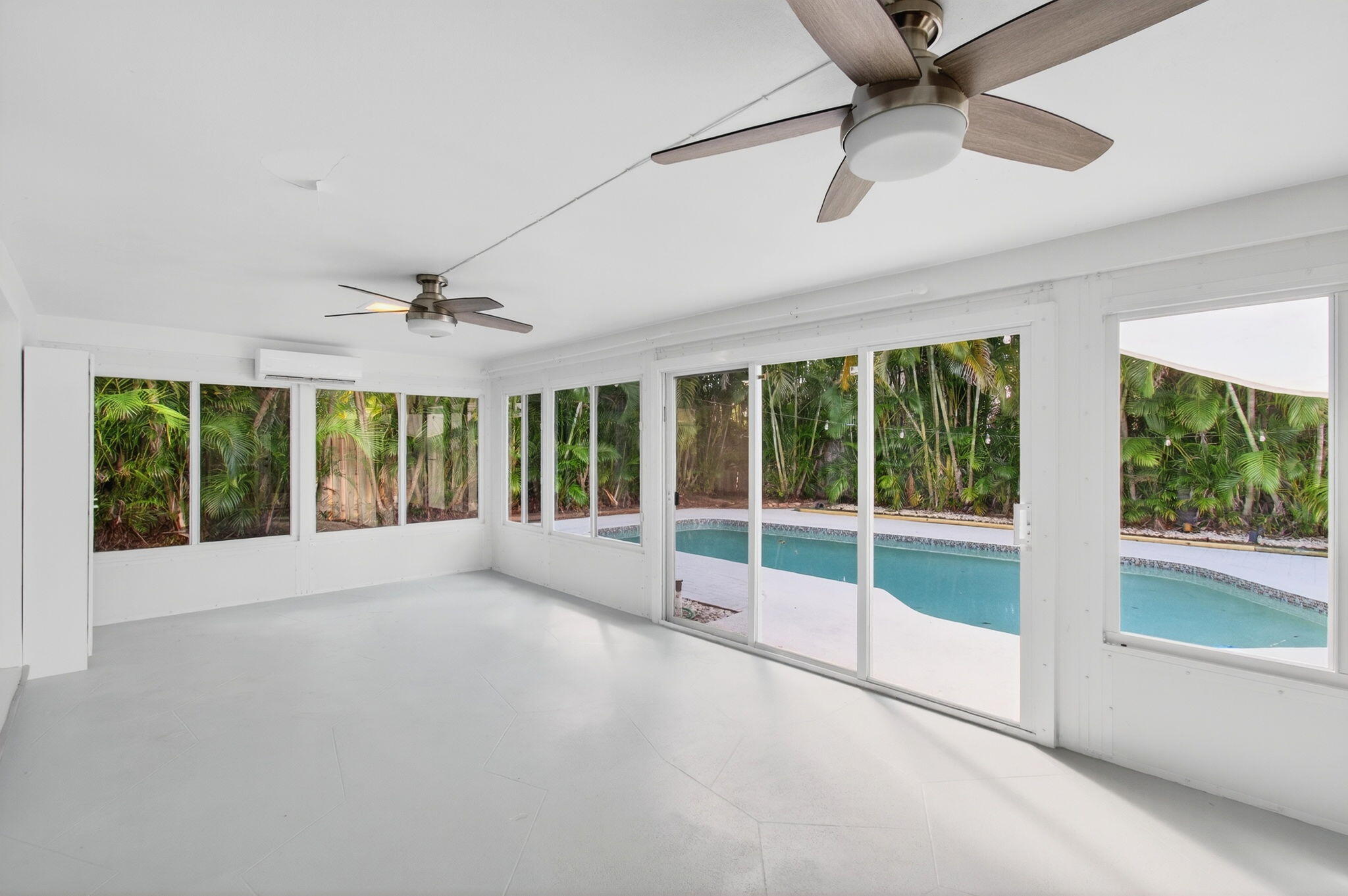 699 Northwest 16th Avenue Boca Raton, FL 33486 - Photo 35 of 46 a view of an empty room with a fireplace and a large window