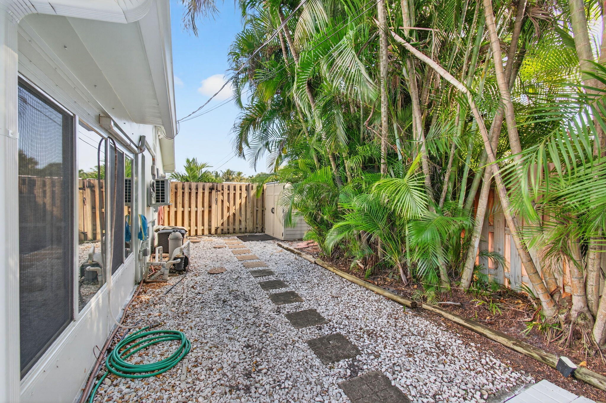 699 Northwest 16th Avenue Boca Raton, FL 33486 - Photo 37 of 39 a view of a porch with a trees