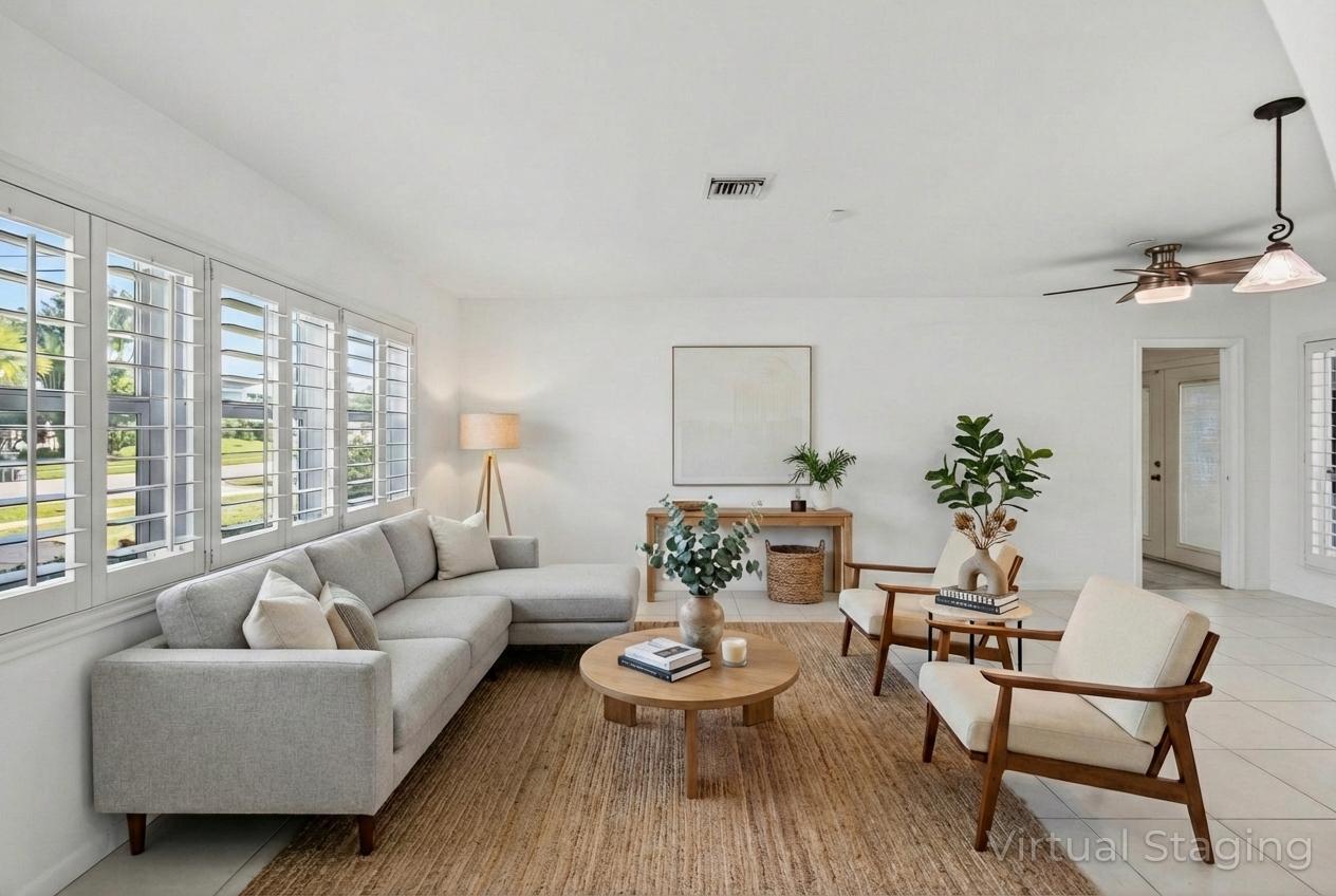 699 Northwest 16th Avenue Boca Raton, FL 33486 - Photo 4 of 39 a living room with furniture and a large window