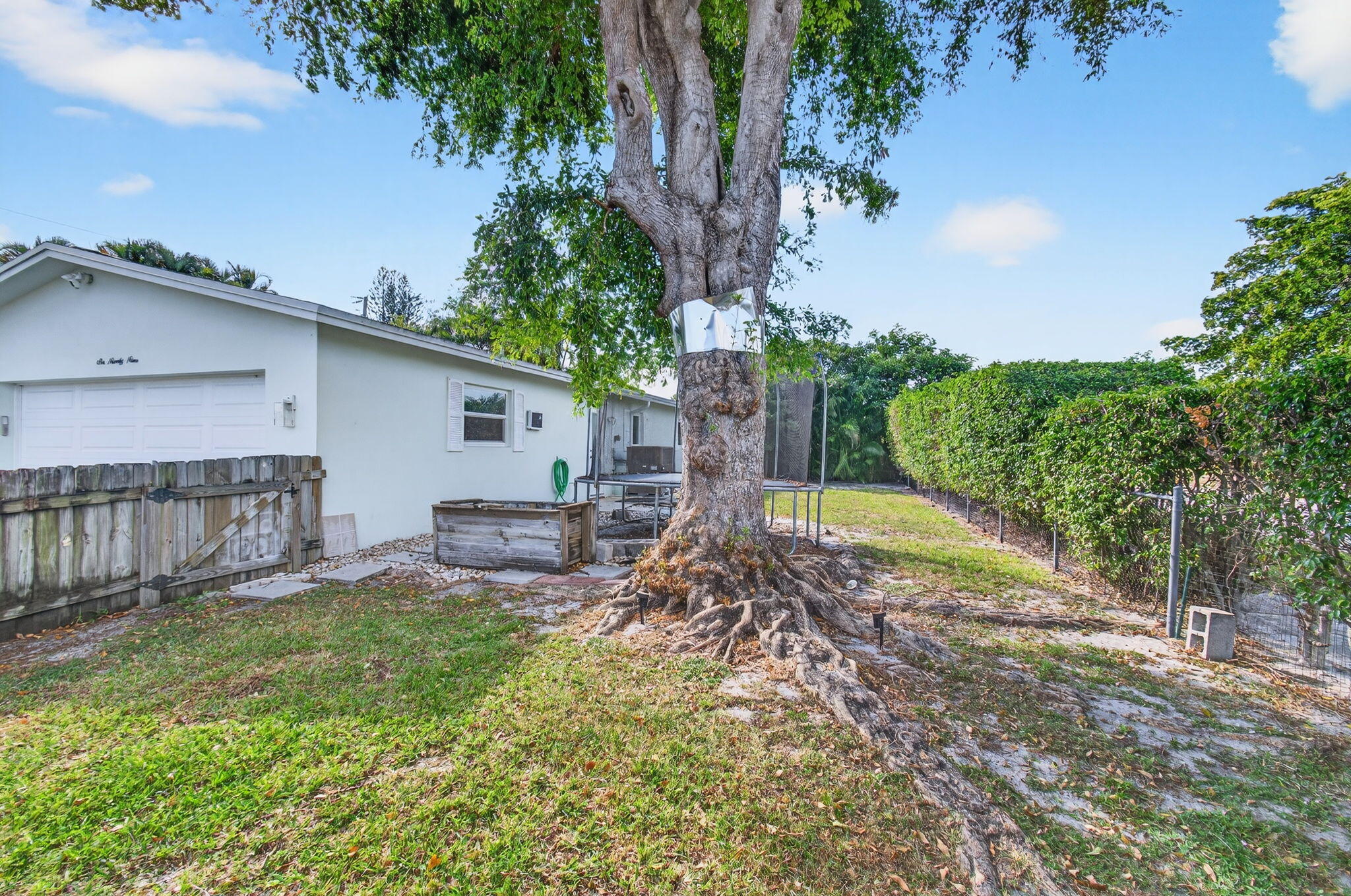 699 Northwest 16th Avenue Boca Raton, FL 33486 - Photo 44 of 46 a view of a house with backyard and sitting area