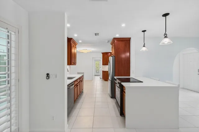 a kitchen with a sink and a refrigerator