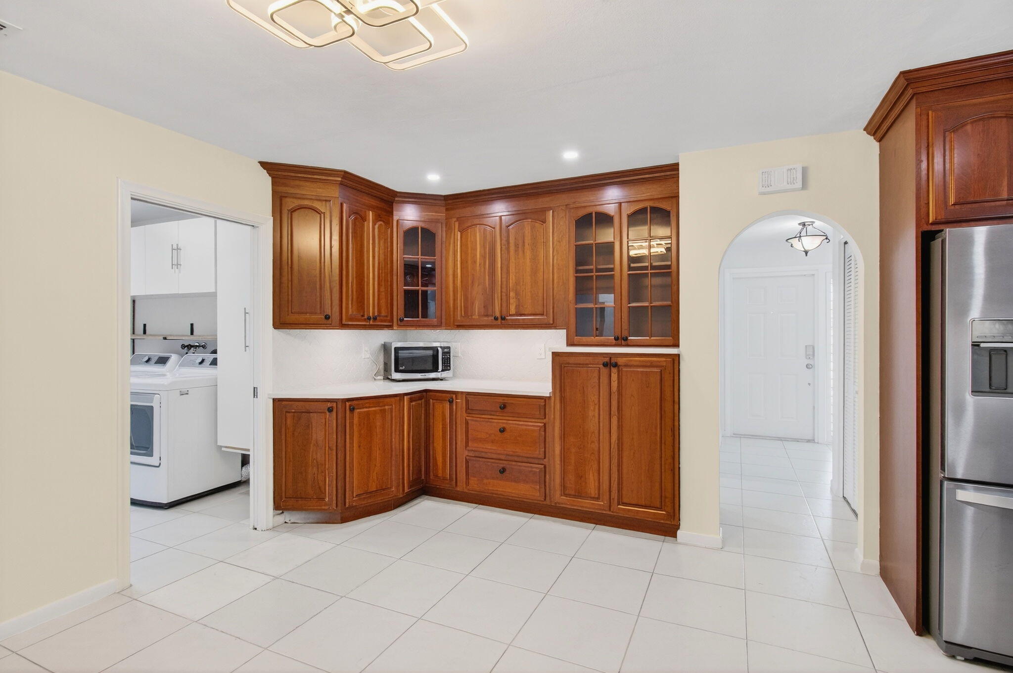 699 Northwest 16th Avenue Boca Raton, FL 33486 - Photo 8 of 32 a large kitchen with cabinets and stainless steel appliances