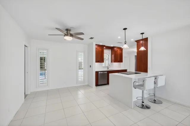 an empty room with a empty space and windows