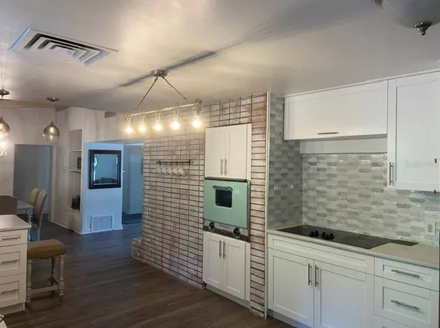 a bathroom with a shower and a sink