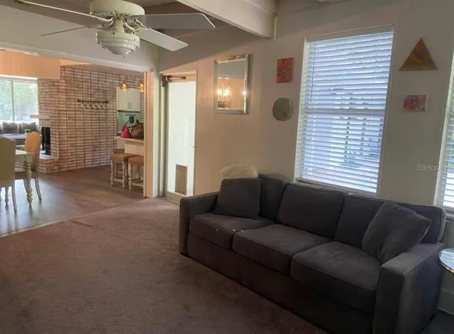 a living room with furniture and a window