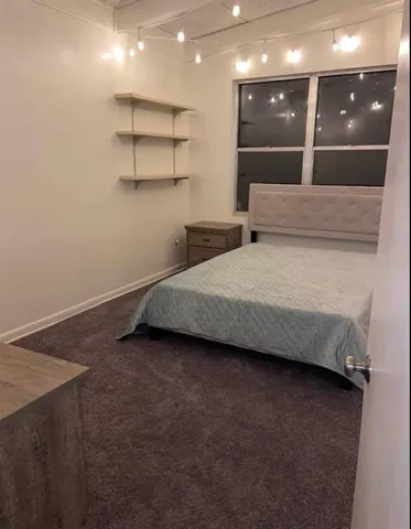 an empty room with a empty space and a window