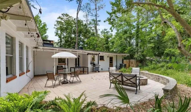 aerial view of a house with table and chairs