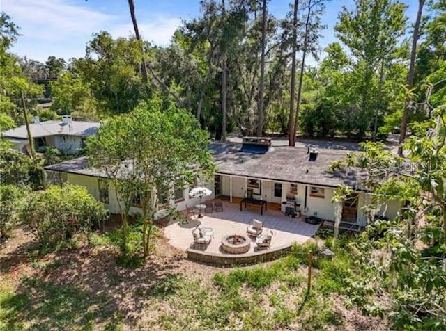 813 Northwest 22nd Street Gainesville, FL 32603 - Photo 29 of 32 aerial view of a house with table and chairs