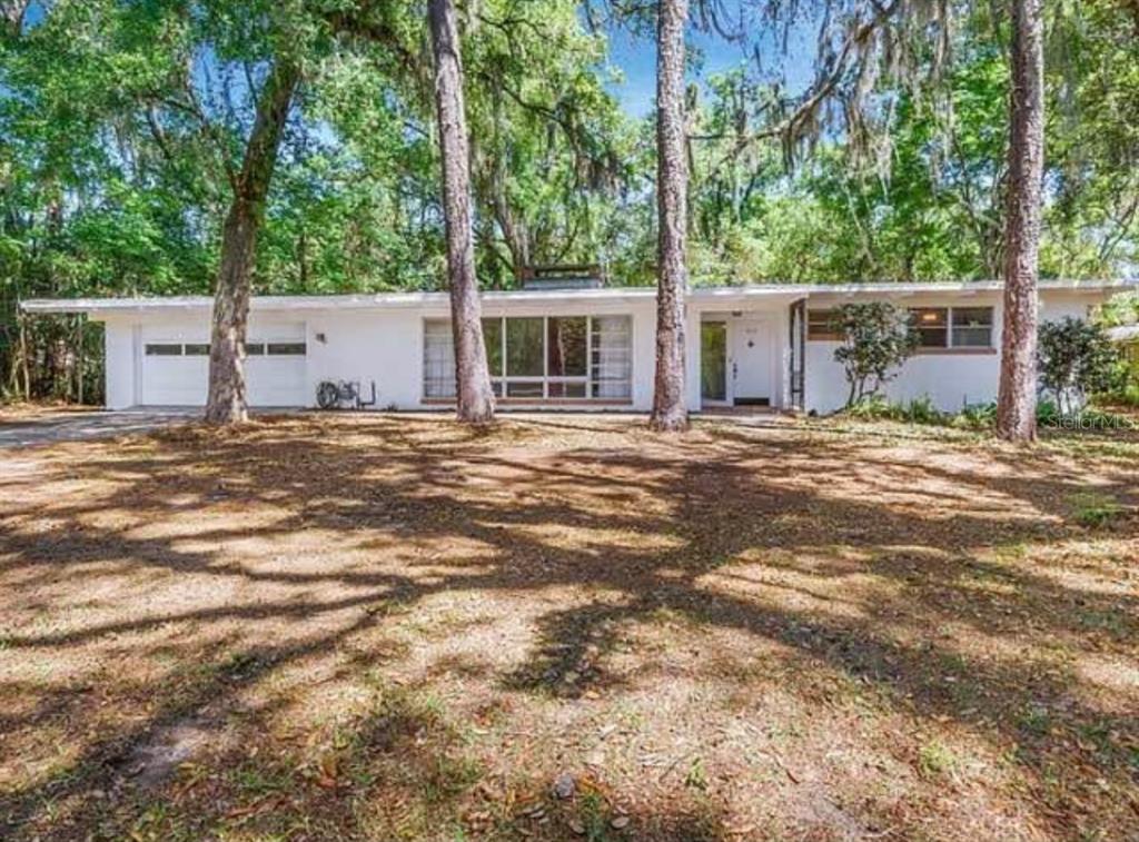 813 Northwest 22nd Street Gainesville, FL 32603 - Photo 30 of 32 a view of a house with a tree in front