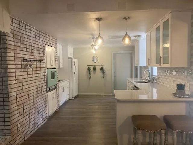 a bathroom with a sink a shower a mirror and a bathtub