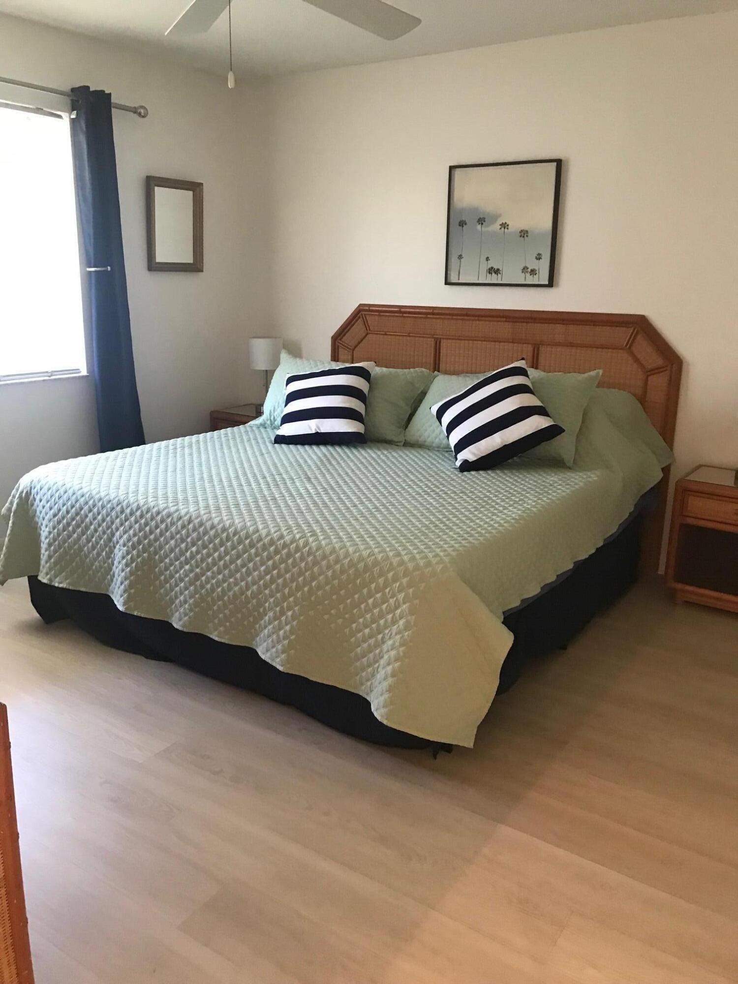 353 Highway 1, Unit D203 Jupiter, FL 33477 - Photo 13 of 13 a bedroom with a bed and window