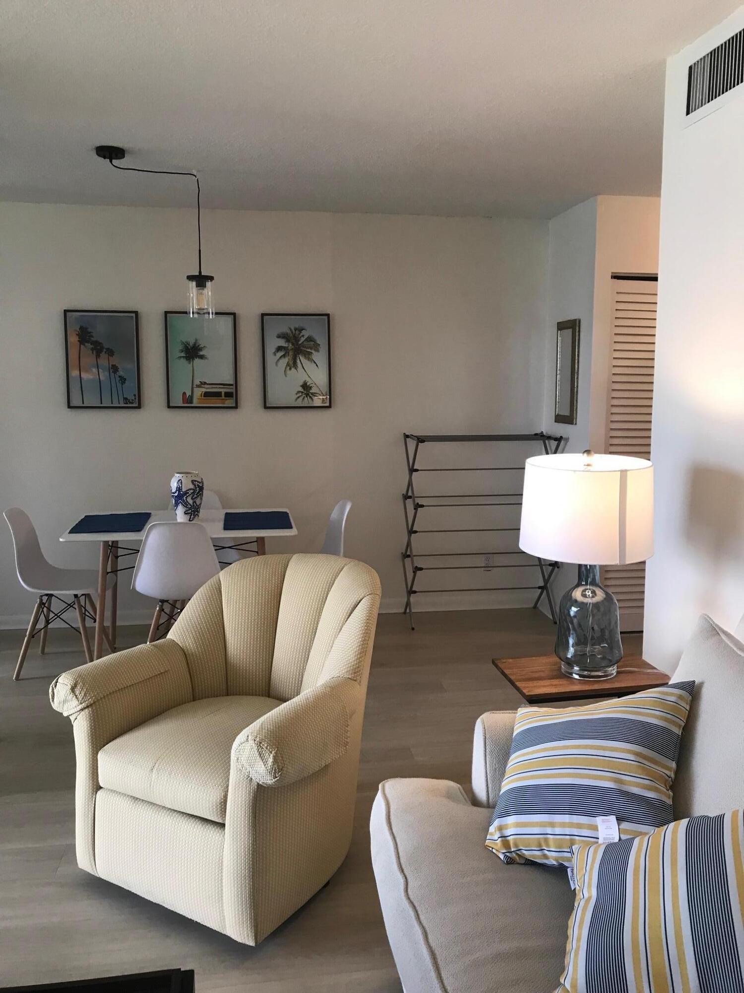 353 Highway 1, Unit D203 Jupiter, FL 33477 - Photo 6 of 13 a living room with furniture and a lamp