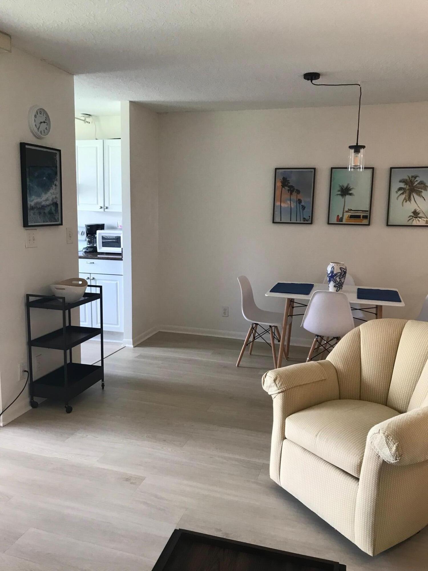 353 Highway 1, Unit D203 Jupiter, FL 33477 - Photo 7 of 13 a living room with furniture and a flat screen tv